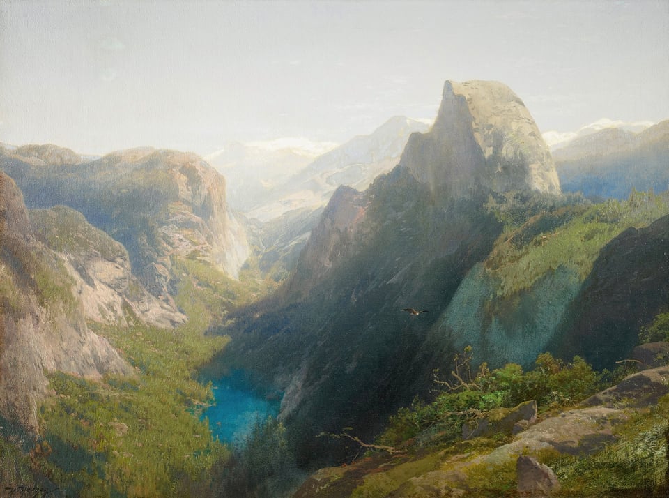 View of mountains, grass and a green blue lake in Yosemite
