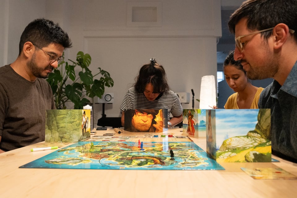 Slightly different people sitting around a table playing a very different game.