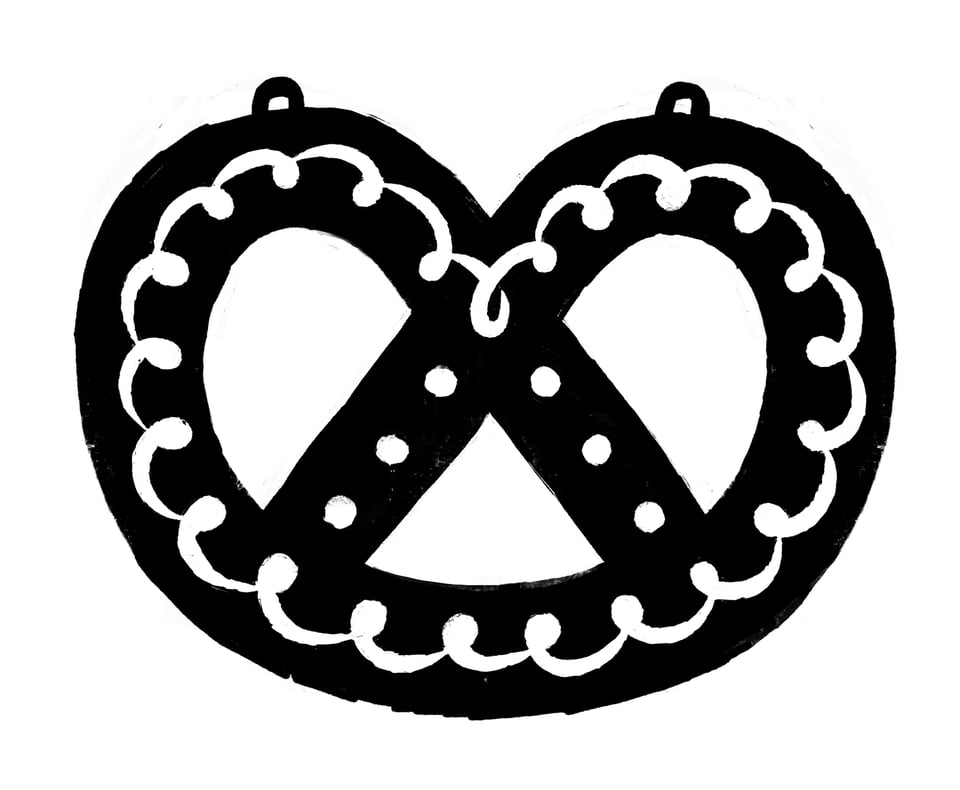 A black and white drawing of a bretzel. It has some white icing on it that looks like a chain of commas.