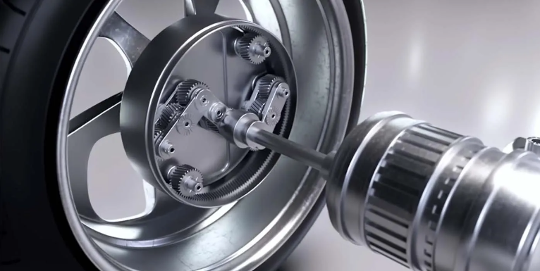 The inside of a new electric vehicle wheel with the drive mechanism located within the wheel rim. The wheel is connected via a drive shaft.