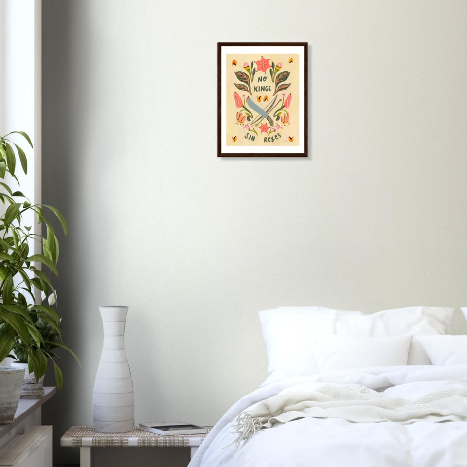 Wood framed Illustration of aji and bixa plants with a machete and bow/arrow crossed in the center. Handwritten text reads "NO KINGS, SIN REYES". Hanging on a bedroom wall.