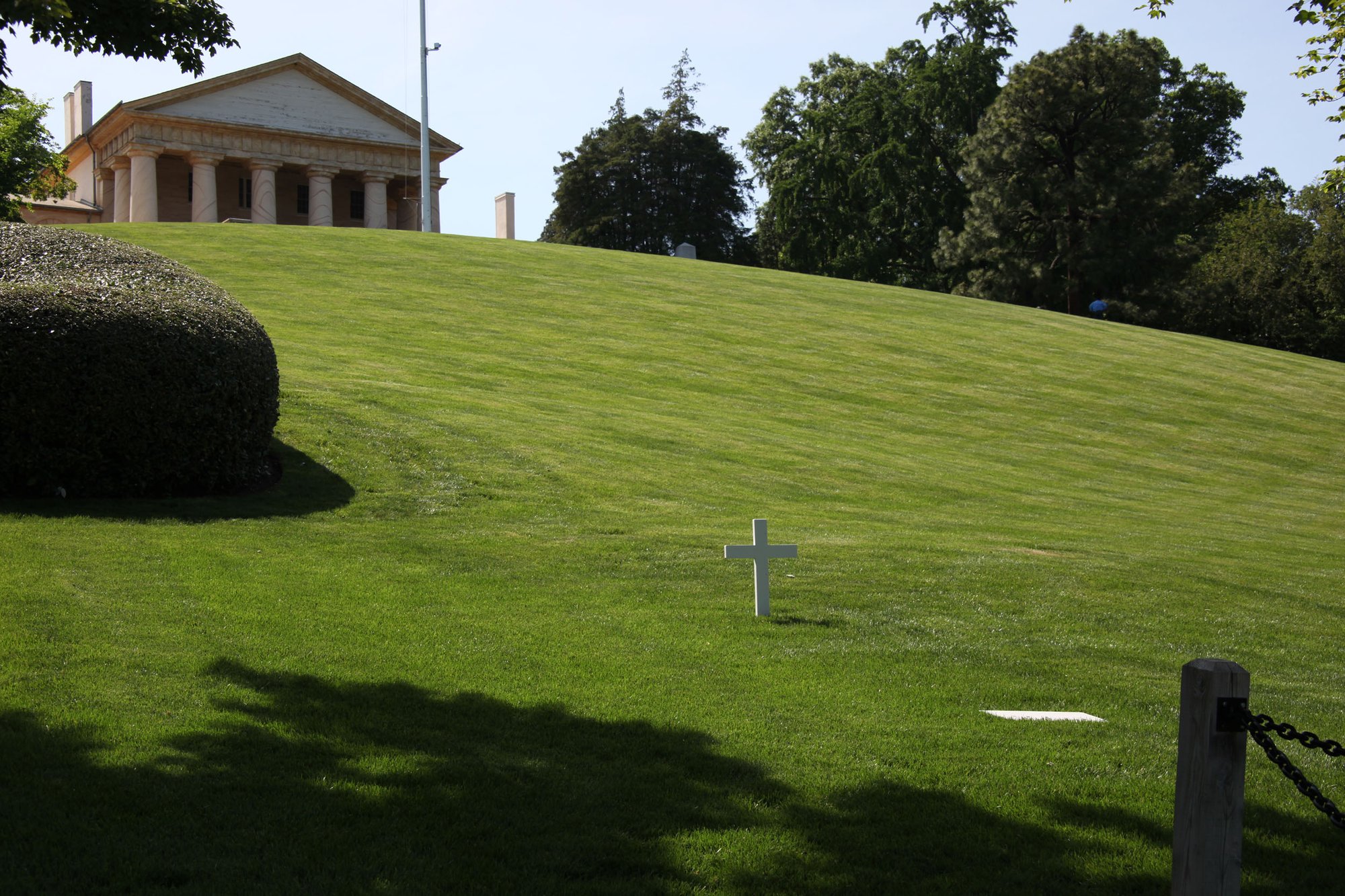 Robert F. Kennedy's grave at Arlington National Cemetery, marked with a simple white cross