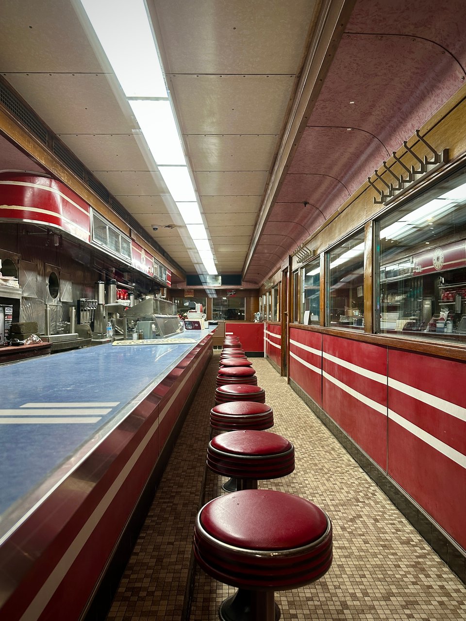 Interior shot of Mickey's Diner in St. Paul, with empty seats in front of the counter
