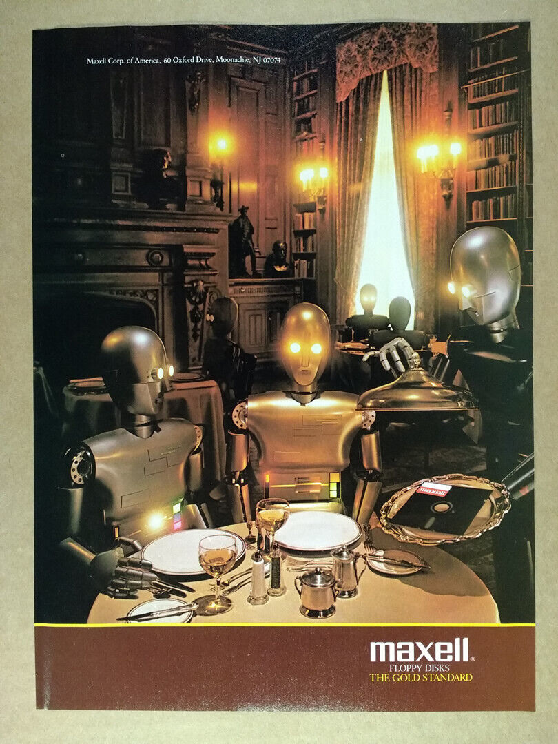 Two robots (one gold, one silver) sitting in a romantic dimly lit restaurant. A robot waiter is presenting a platter to the two diners and on the platter is a 5.25" floppy disk.