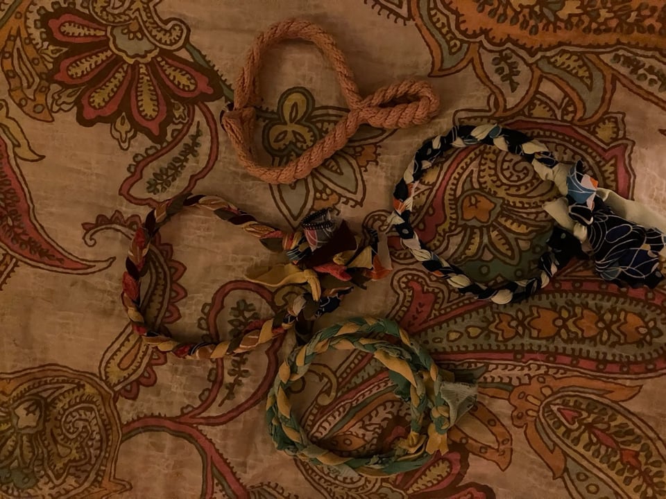 Fabric necklaces on a patterned background