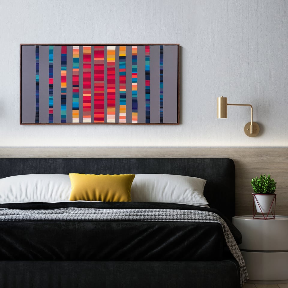 vibrant textile artwork on the wall of a bedroom