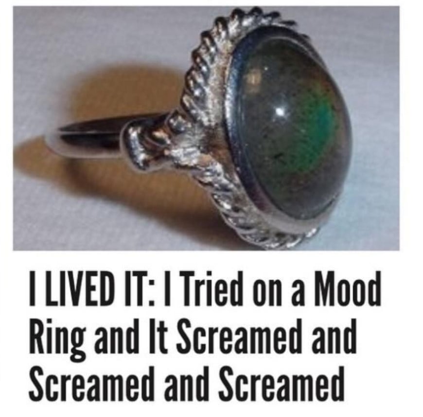 A photo of an old, tarnished silver mood ring. Beneath is the headline that reads - "I LIVED IT: I Tried on a Mood Ring and It Screamed and Screamed and Screamed"