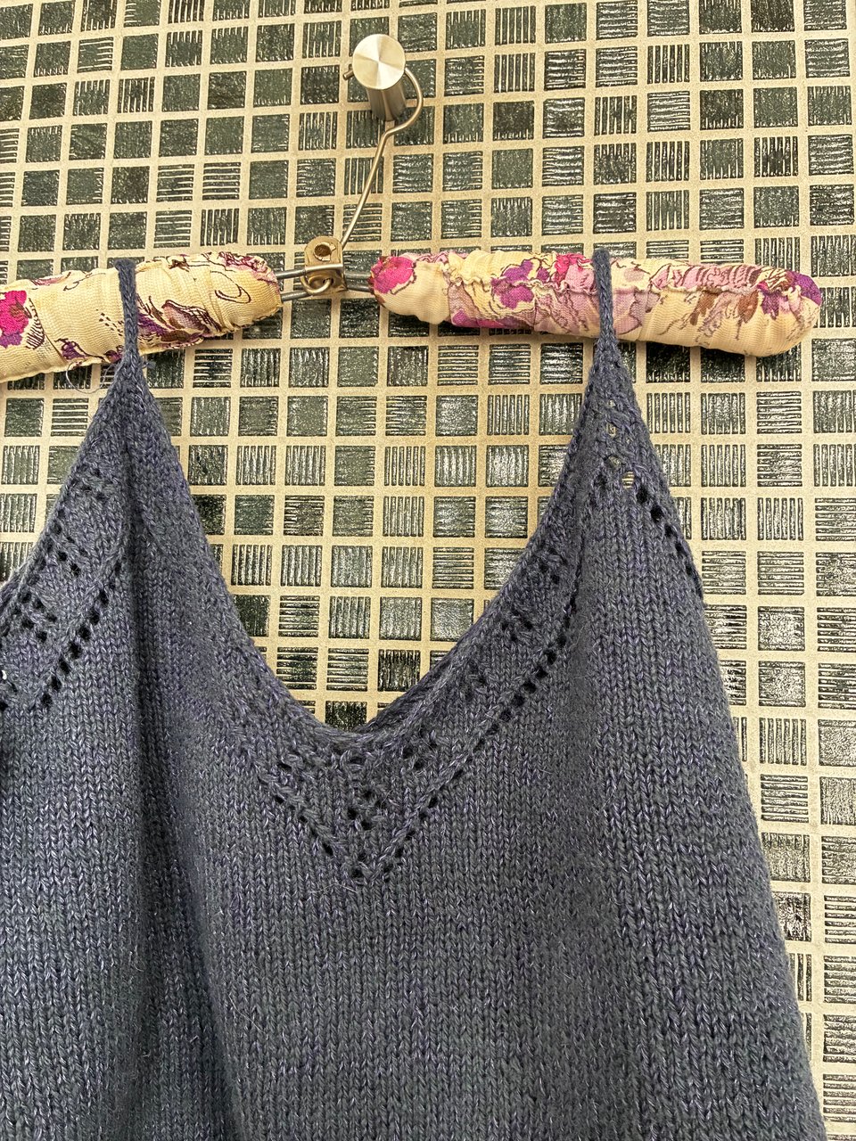 Camisole with lace on the front edges, knitted in a dark blue cotton wool yarn