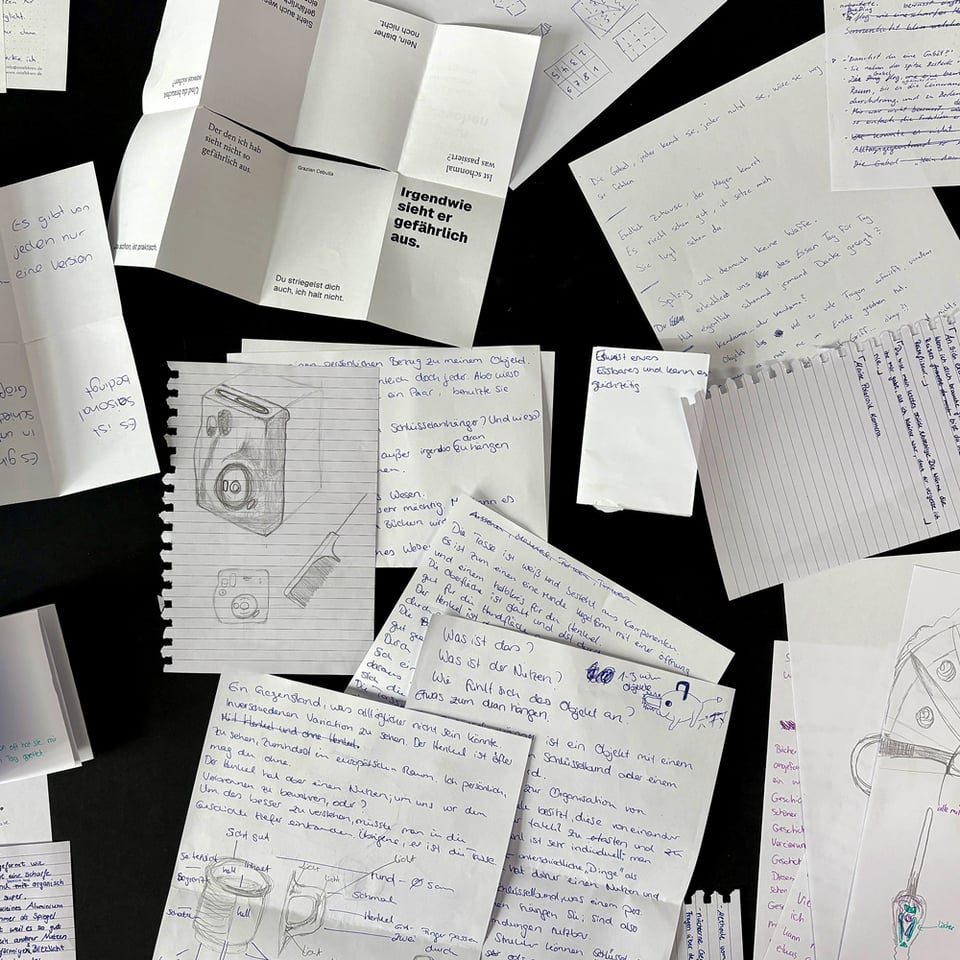 birseye view of a desk with lots of handwritten manuscripts