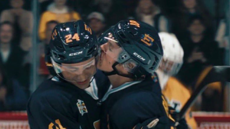 Ilya (right) gives Shane (left) a helmet kiss at the all-star game.