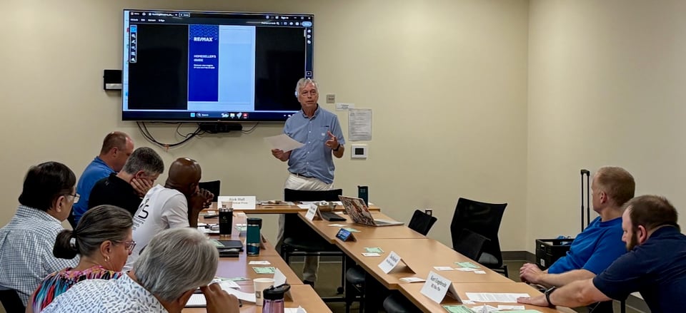 Kurt presents to a room of NRG members about the ins and outs of being a realtor.