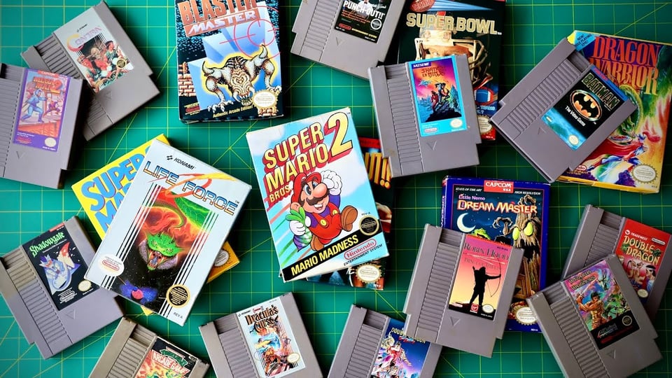 A pile of NES cartridges and boxes