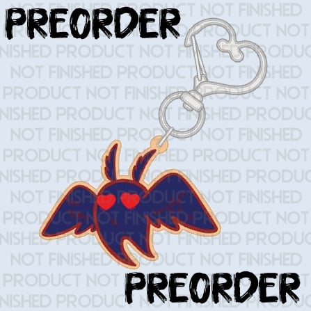 PREORDER of a mothman keychain with a heart shaped clasp.