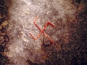 Drawing of a swastika on the Snoldelev Stone found in Ramsø, Denmark (9th century) - Snoldelevsunwheel.jpg