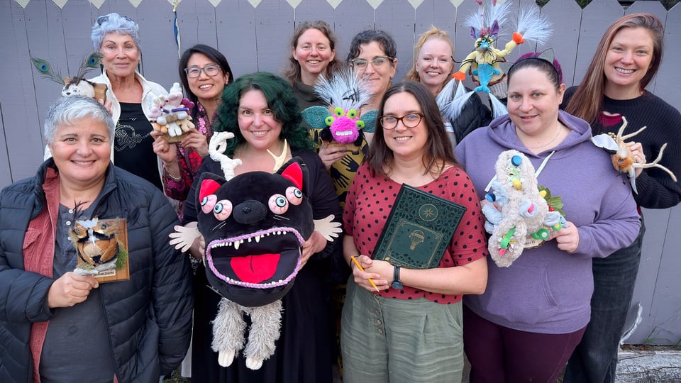 a group of people holding their creations