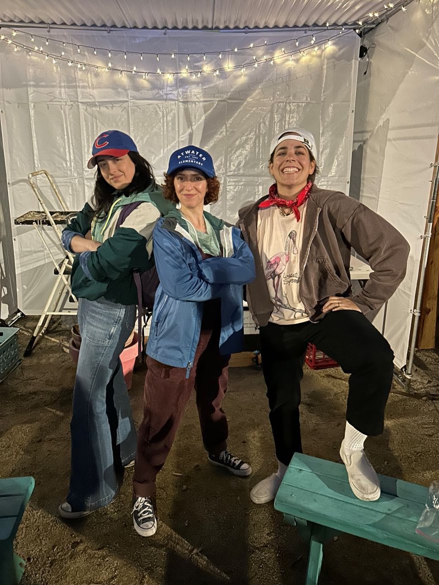 Three young women smiling and looking bold and proud