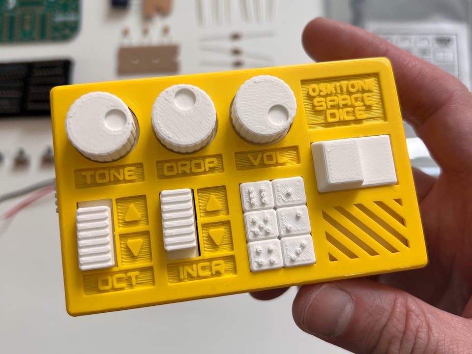 Space Dice close up with kit components below