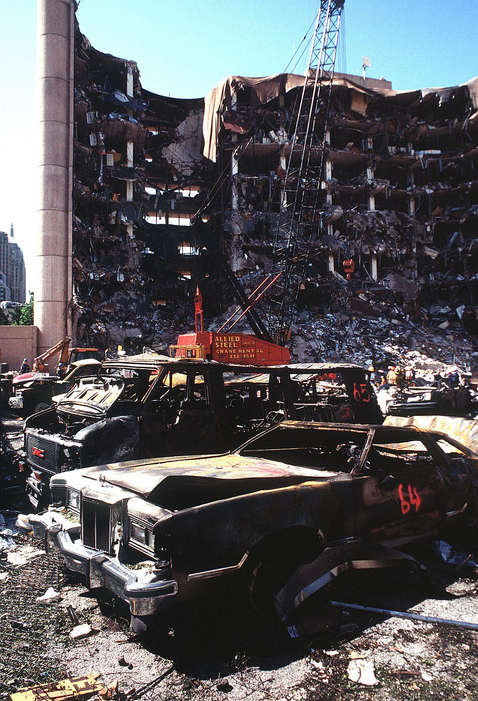 The Alfred P. Murrah Federal Building in Oklahoma City following the April 19, 1995 bombing — destroyed building and burned vehicles, photographed April 21, 1995