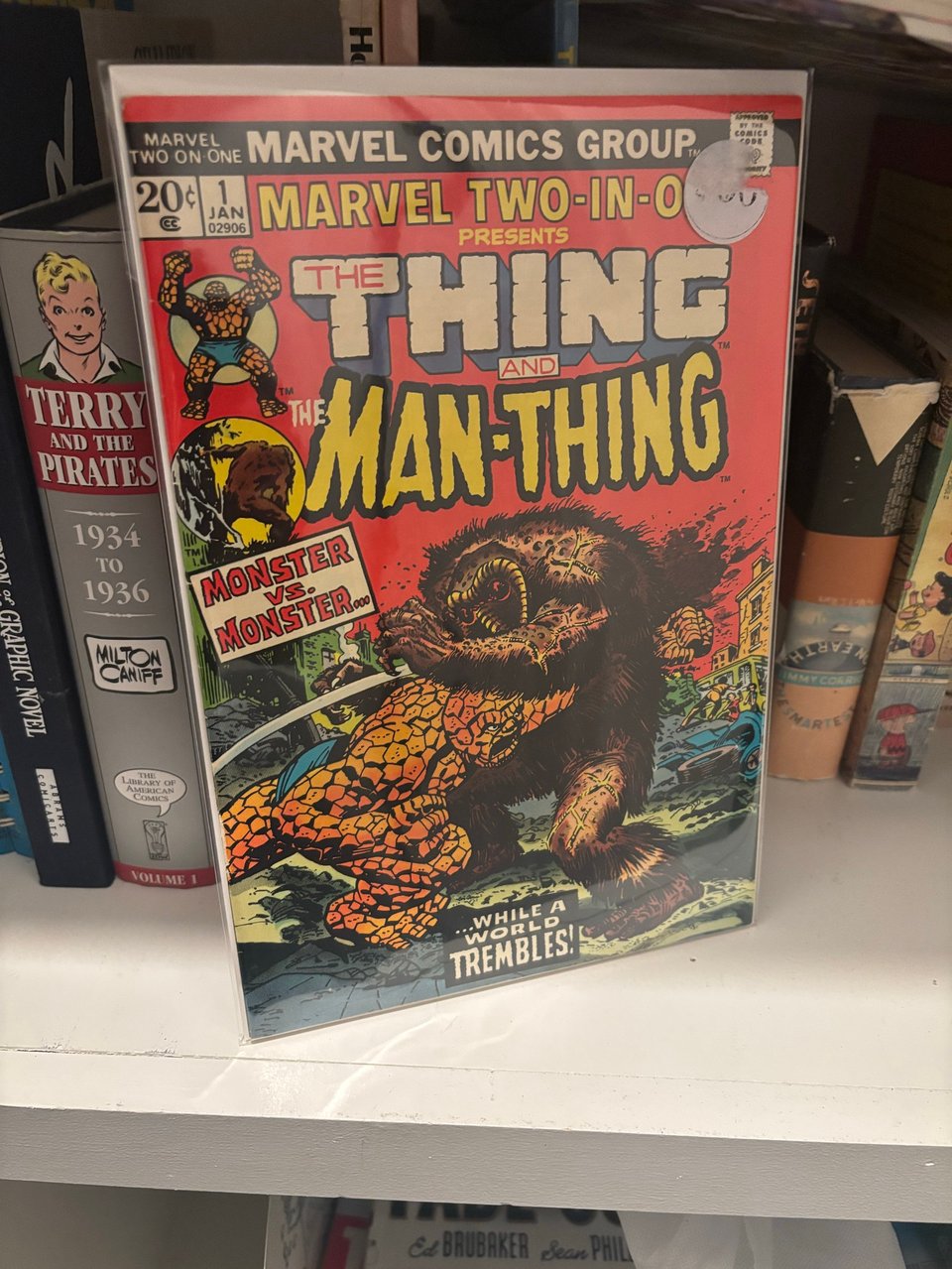 a copy of marvel two-in-one #1 on neil's bookshelf