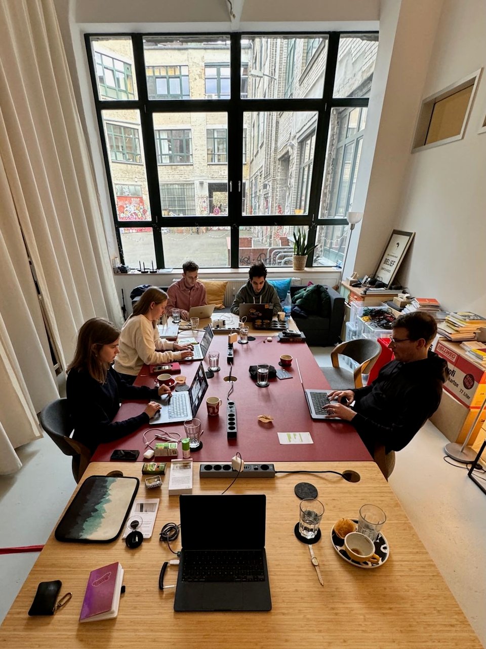 Five people from Village One sitting around a conference table