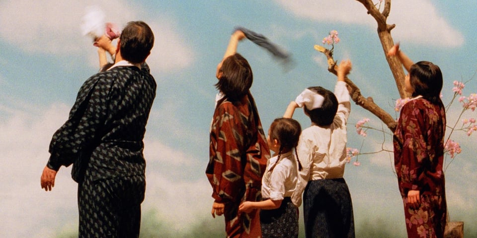 Some Japanese people waving goodbye.