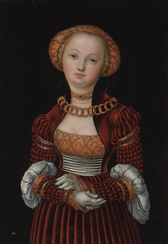 A portrait of an elegant young lady dressed in a deep red and black dress trimmed with white ruffs around the elbow, white gloves, a flat gold cap, a gold and white bodice, and a thick gold chain and bejewelled gold choker around her neck The painting has been photographed against a black background. The woman looks pensive, almost sleepy, and her head is angled slightly to the right.