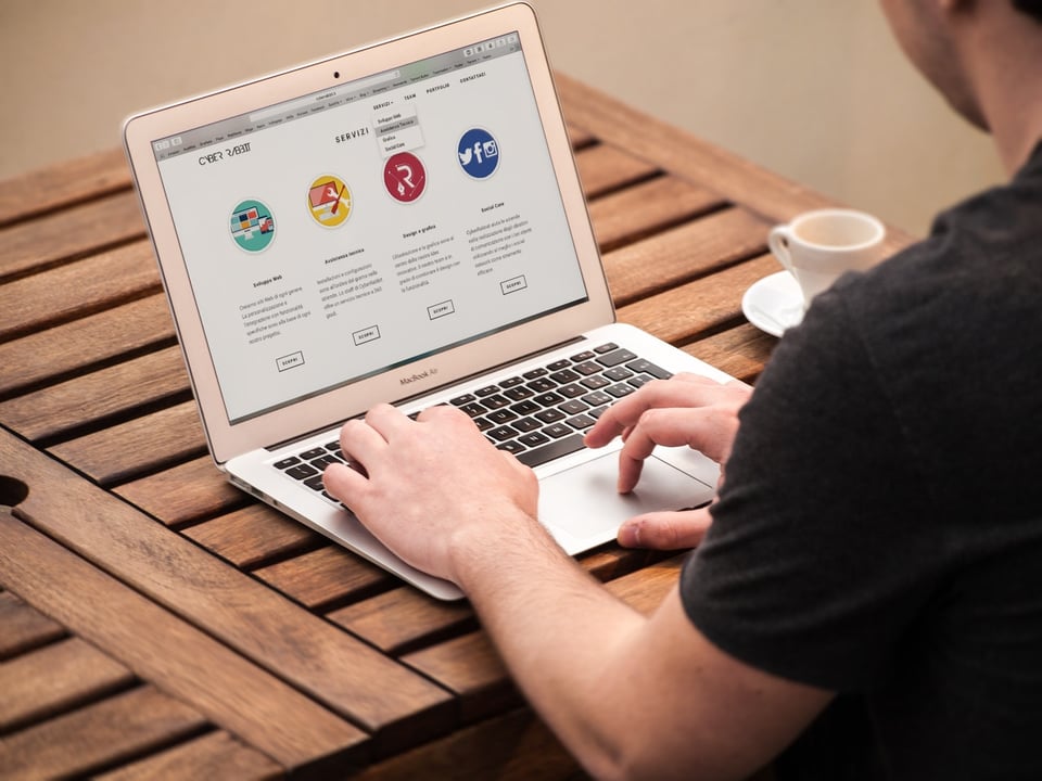 Stock image of a person working at the laptop.