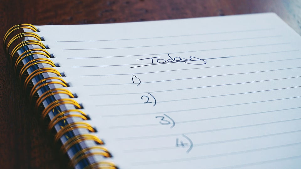 Image of a to-do list written in a notebook.