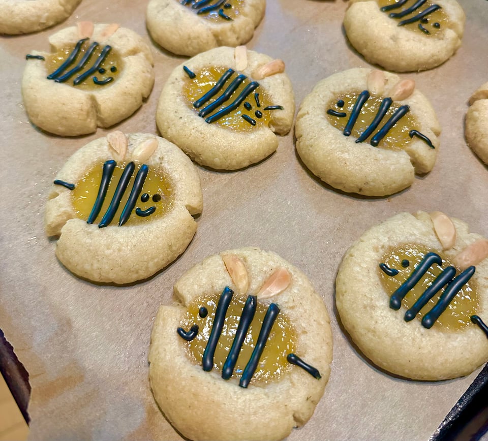 freshly baked lemon thumbprint cookies decorated to look like cute bees