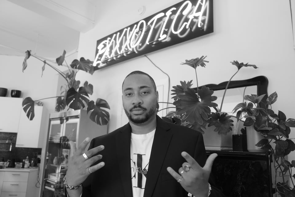 Rollie Pemberton in front of the legendary Bar Exxxotica sign.