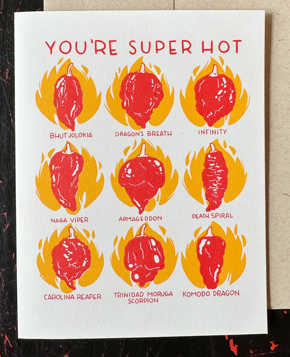A riso-printed card in red and sunflower yellow that reads "You're Super Hot" and has drawings of 9 of the world's hottest Super-Hot pepper varieties