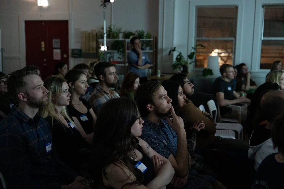 A crowd in a dark room.