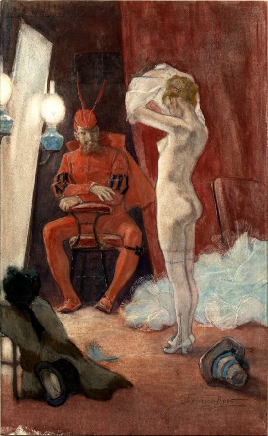 A horned man with a goatee, dressed all in red, observes a woman taking her clothes off.
