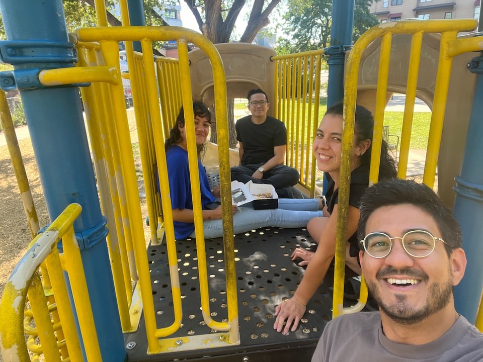 A group of people allegedly sitting at a park.