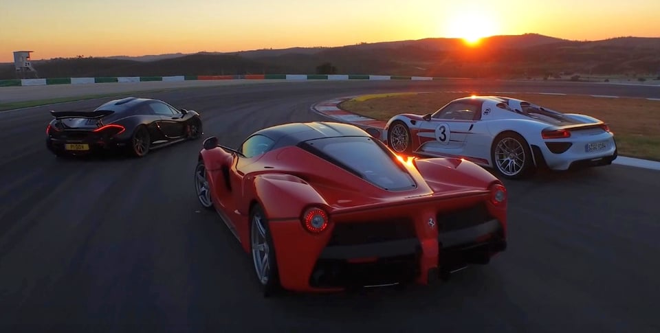 Three hypercars (a black McLaren P1, a red Ferrari LaFerrari, and a white Porsche 918 Spyder