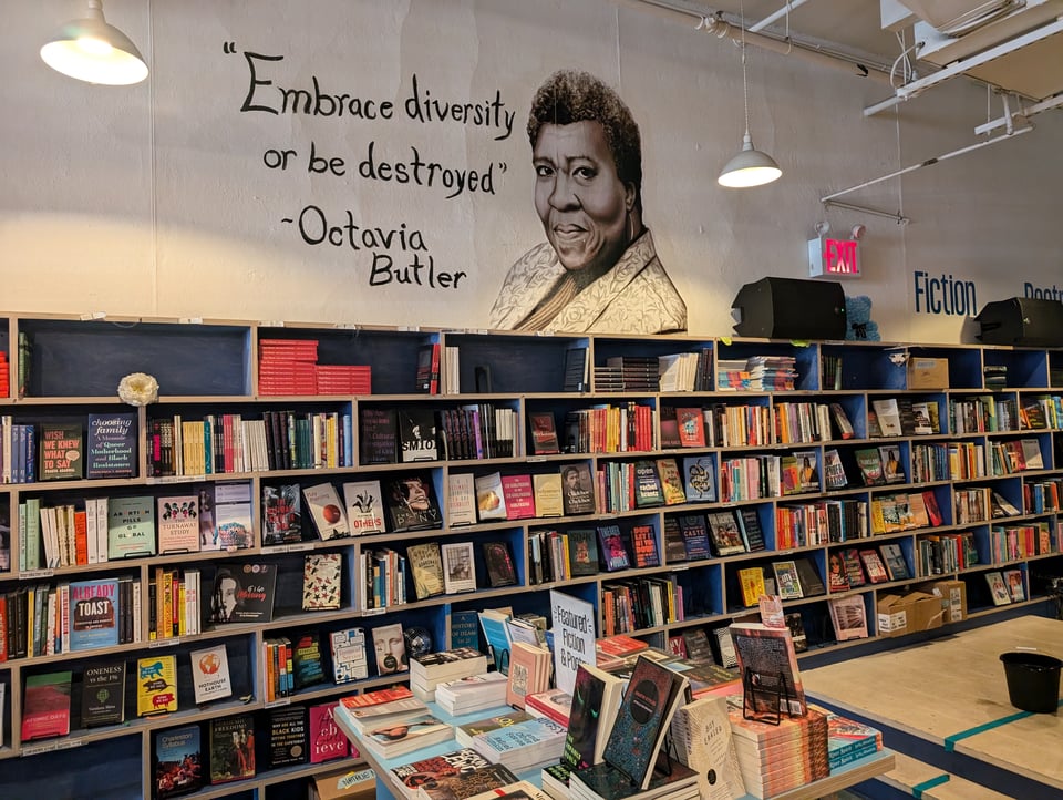 Beautiful image of Octavia Butler over the bookshelves