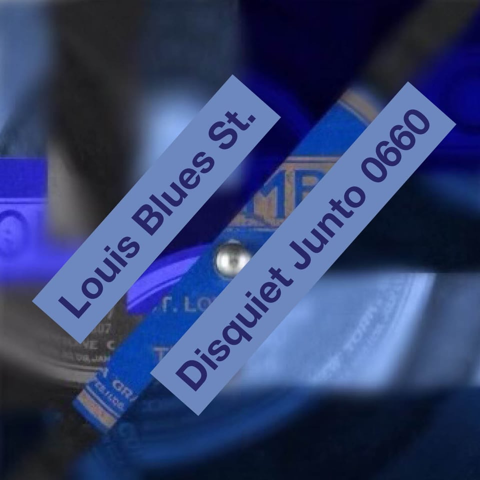 The image is blue and depicts a collage of the label from a jazz record from 1922 of "St. Louis Blues."