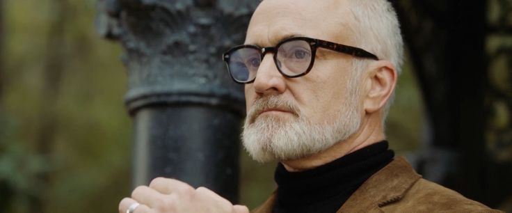 Bradley Whitford looks out at the partygoers in his garden in Get Out.