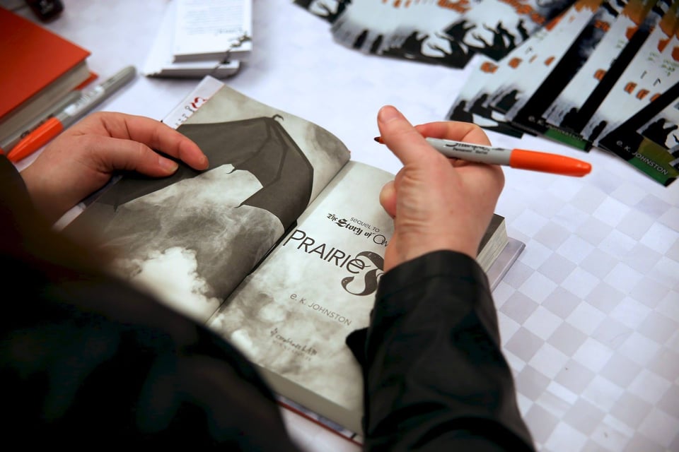 me about to sign a copy of prairie fire