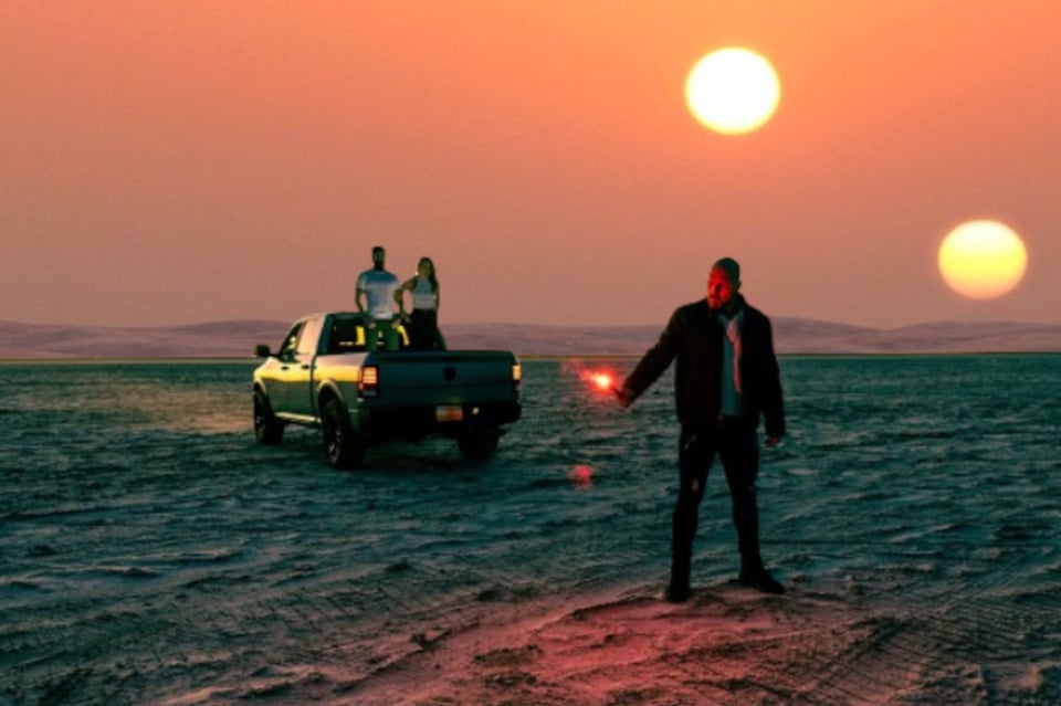 Jon Moxley and friends standing in front of the two setting suns of Tatooine.