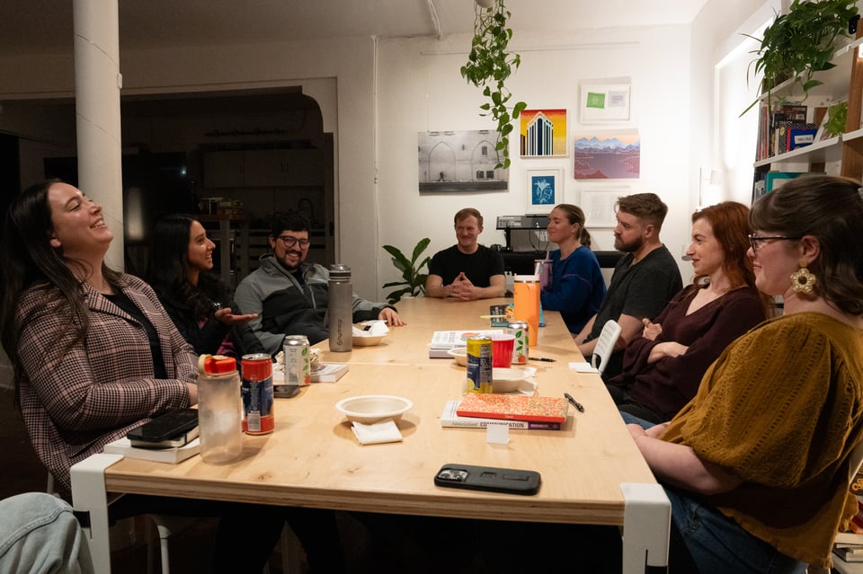 A group sitting around a table.