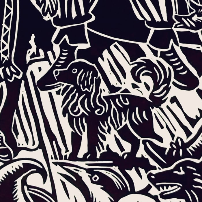 Close up of the linocut from above, highlighting a little dog image.