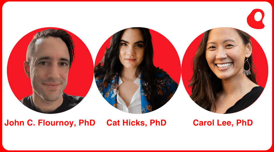 three people smiling in front of a red background