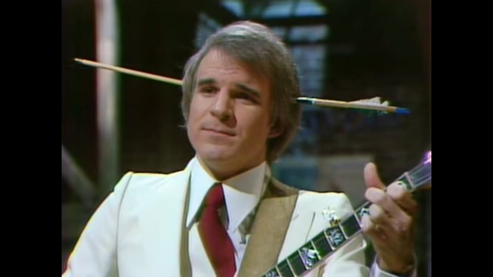 a man holding a guitar