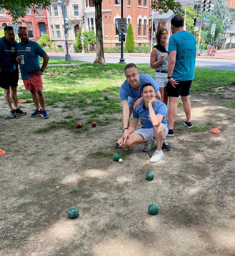 a group of people playing bocce ball