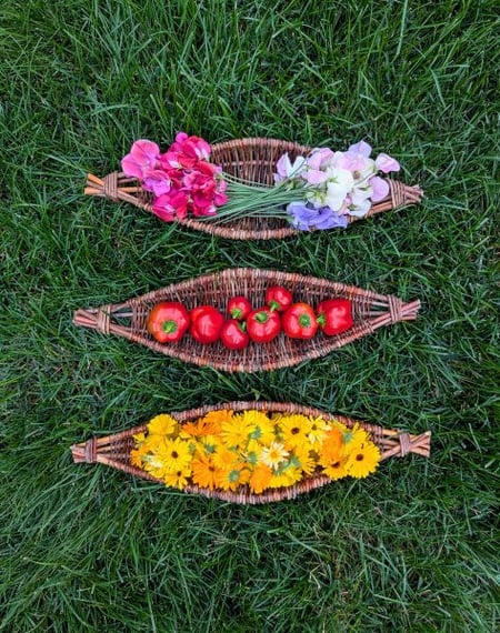 Willow baskets holding flowers and vegetables