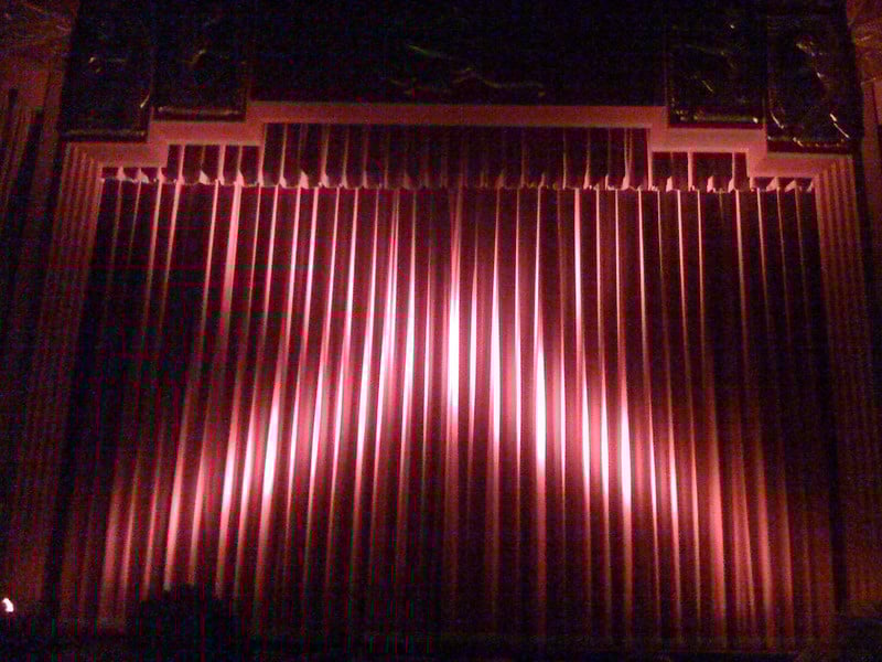 a red curtain in a theater