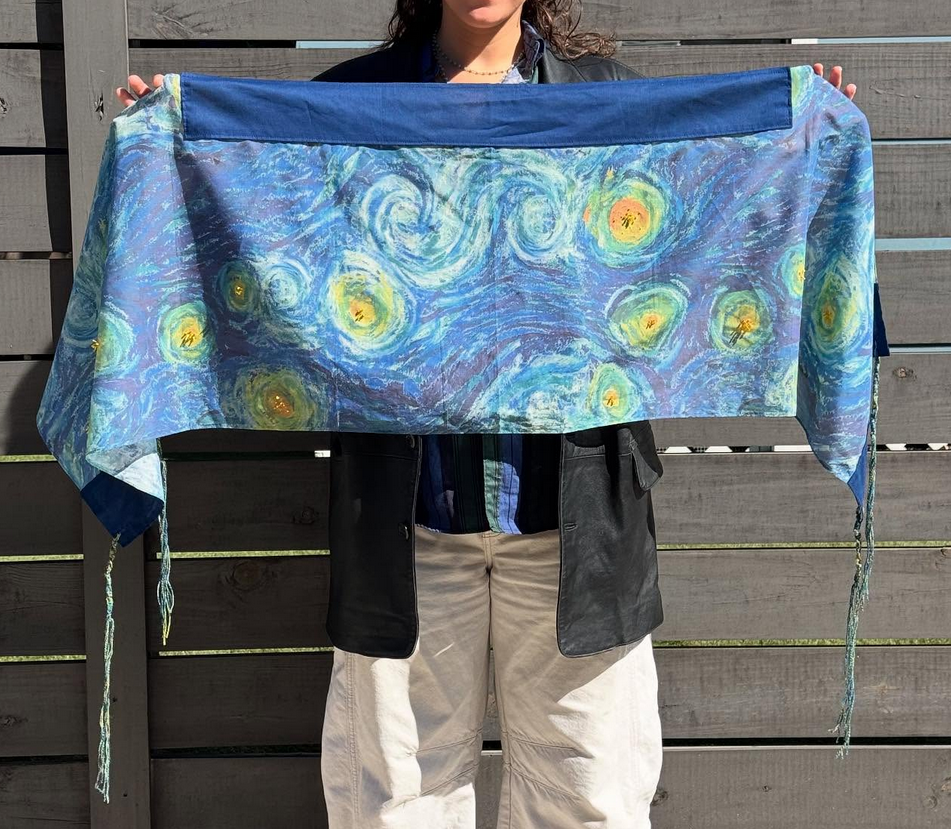 blue swirly tallis with a starry night inspired pattern. 