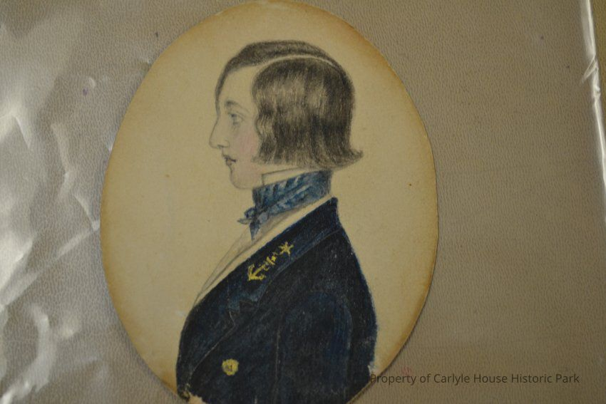 A miniature portrait of a young man in a naval uniform in profile.