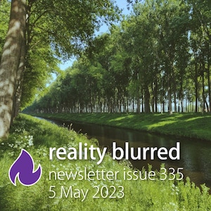 Trees lining a river with flowers on the riverbank, with the words reality blurred newsletter issue 335, 5 May 2023